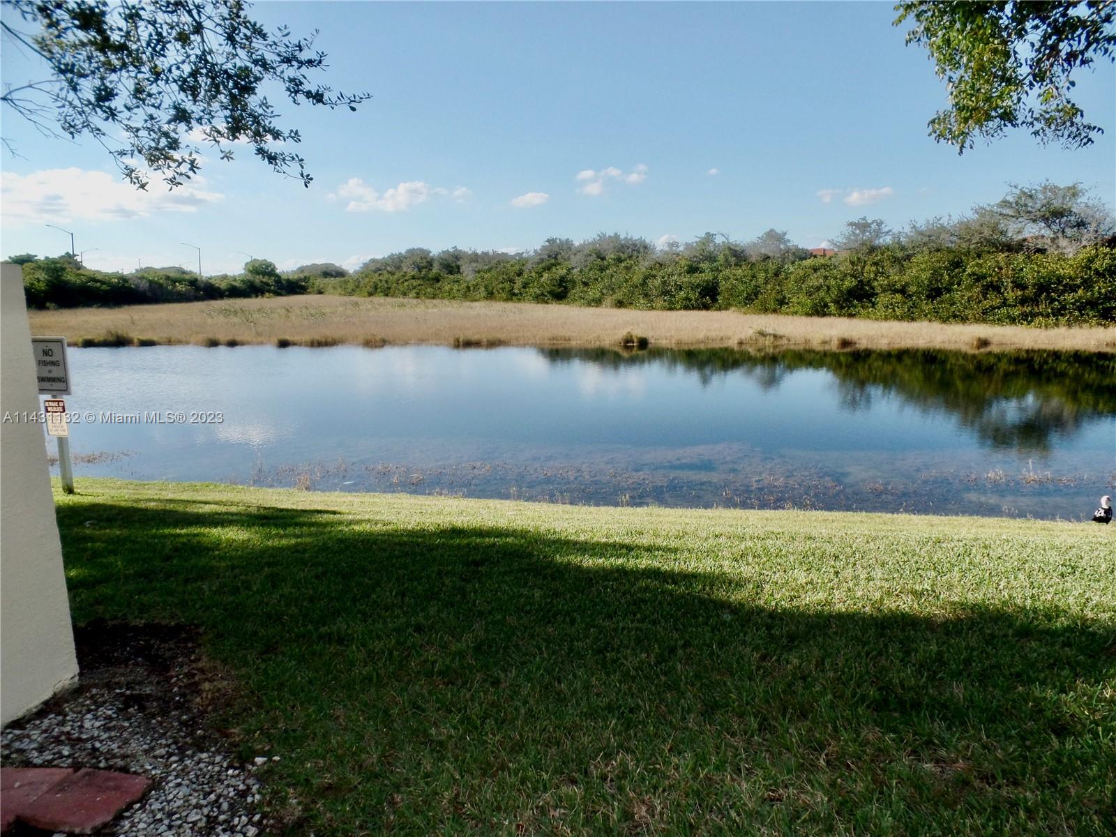 4744 Southwest 165th Avenue, Unit 4744 Miramar, FL 33027 - Photo 27 of 34 a view of a lake with houses in the back