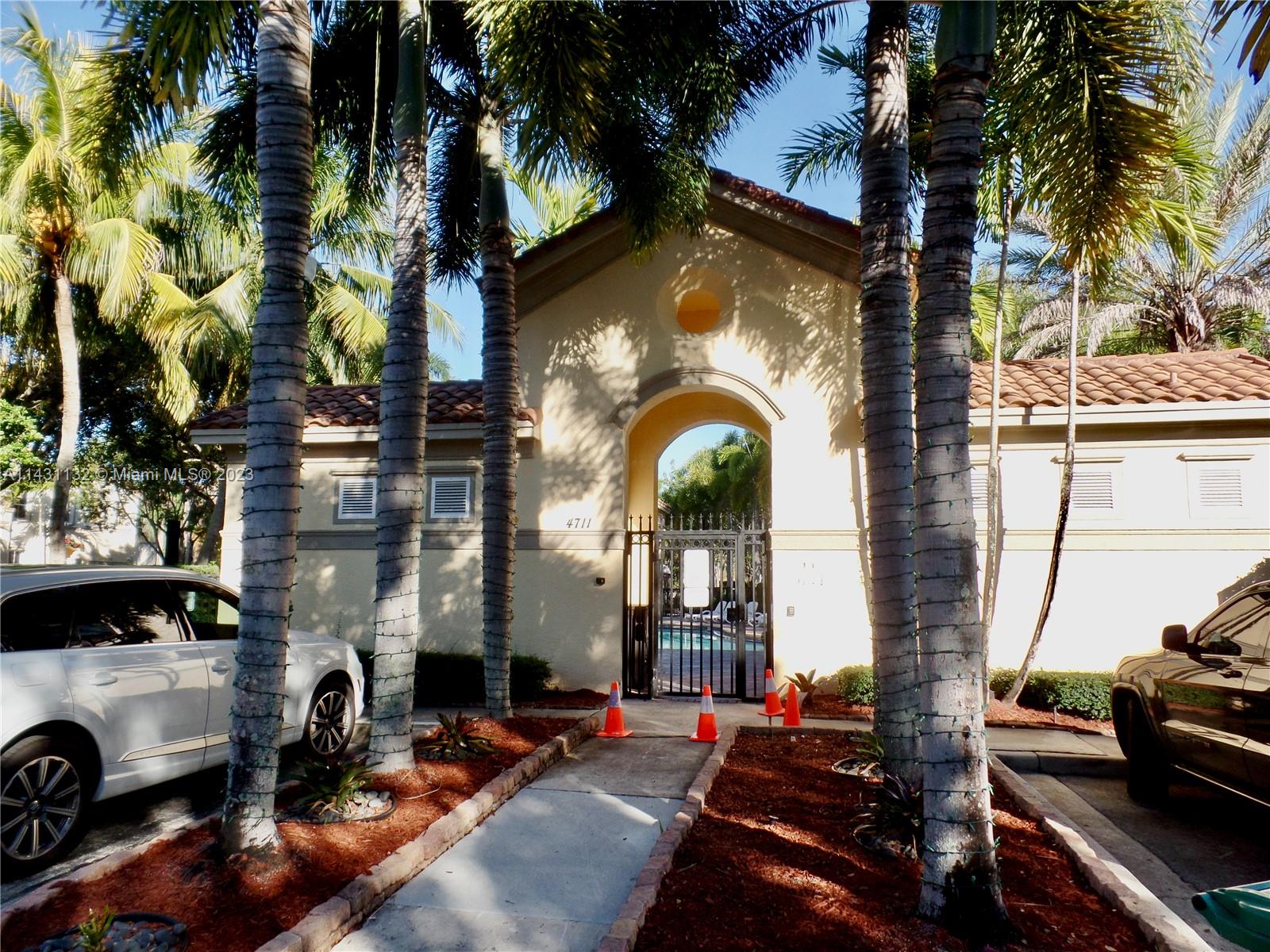 4744 Southwest 165th Avenue, Unit 4744 Miramar, FL 33027 - Photo 31 of 34 a view of a car park in front of a house