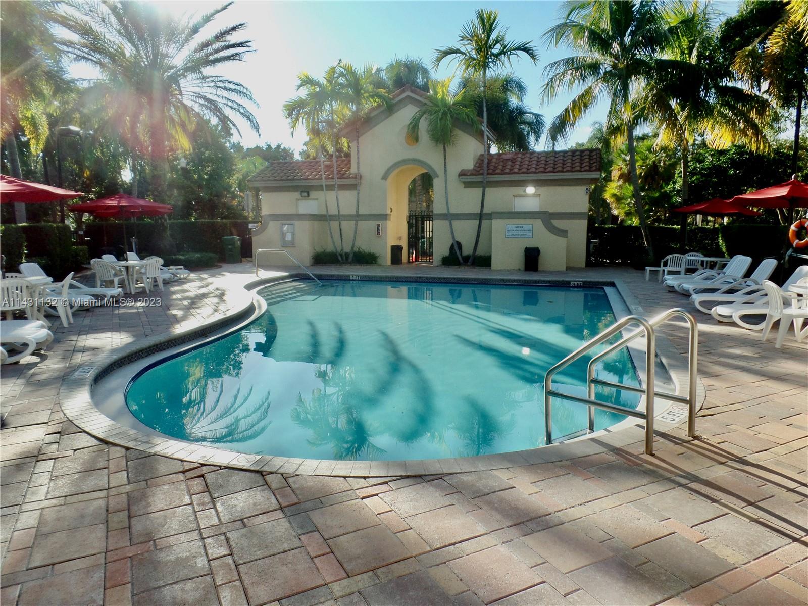 4744 Southwest 165th Avenue, Unit 4744 Miramar, FL 33027 - Photo 32 of 34 a front view of a house with garden