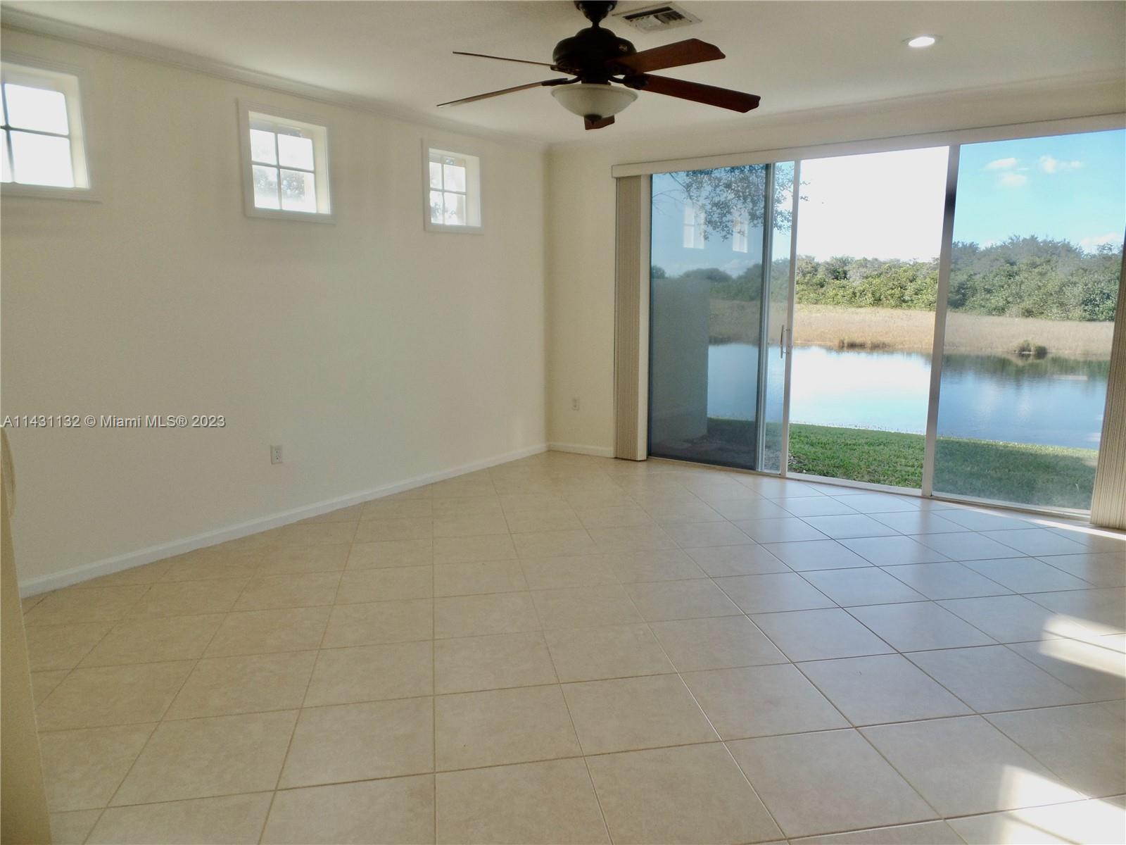 4744 Southwest 165th Avenue, Unit 4744 Miramar, FL 33027 - Photo 6 of 34 a view of an empty room with a window
