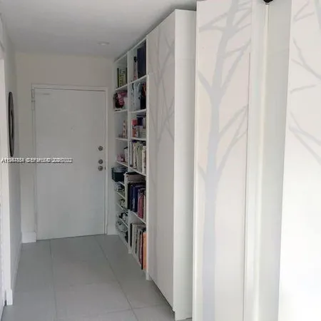 a view of a chairs and table in the balcony