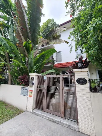 a view of a house with a fence