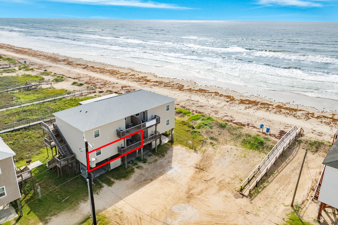 116 Howard Avenue, Unit G Surfside Beach, TX 77541 - Photo 1 of 31 a view of a ocean with beach