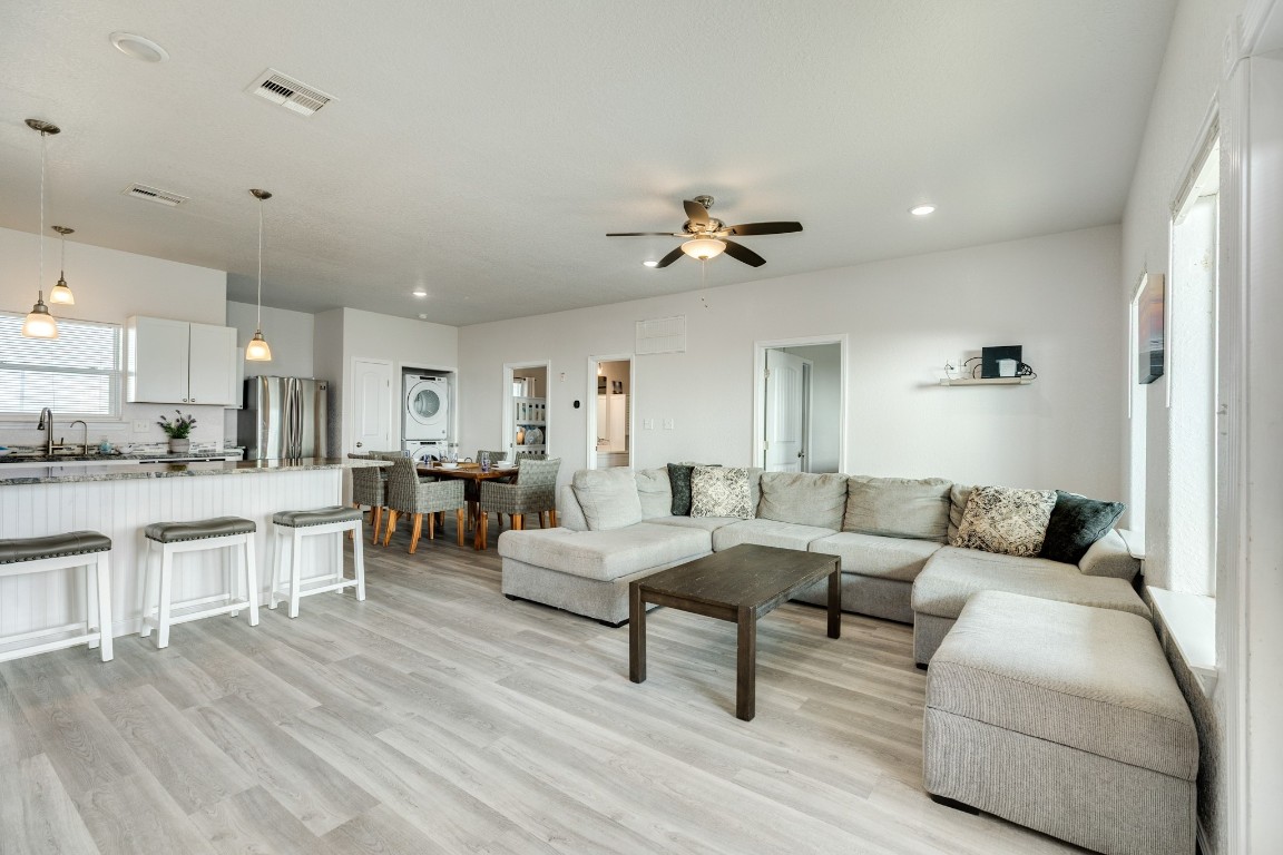 116 Howard Avenue, Unit G Surfside Beach, TX 77541 - Photo 2 of 31 a living room with furniture and view of kitchen