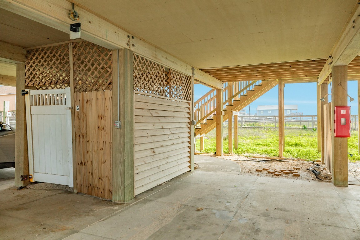 116 Howard Avenue, Unit G Surfside Beach, TX 77541 - Photo 29 of 31 a view of a porch with a table and chairs