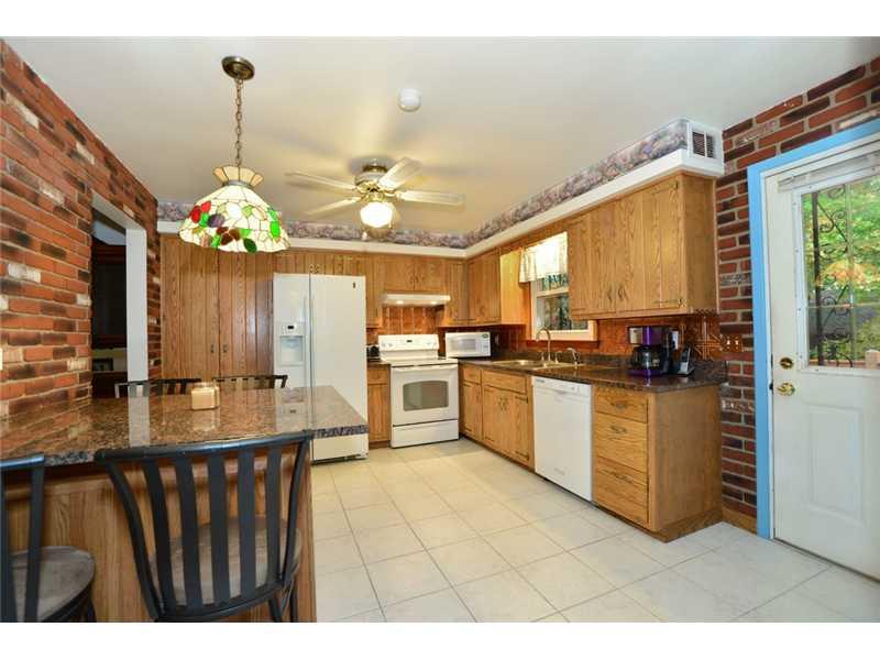 208 Woodcroft Road Economy, PA 15005 - Photo 2 of 15 Kitchen. The eat in kitchen comes equipped with the electric stove, dishwasher, refrigerator and built in pantry.
