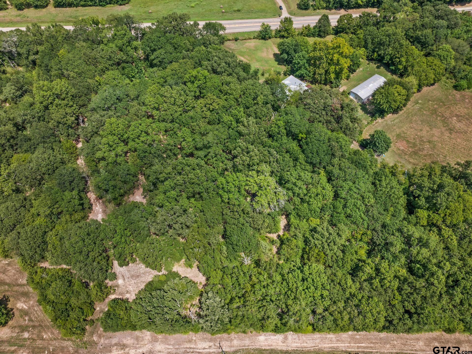 271 US Highway 271 Talco, TX 75487 - Photo 16 of 19 an aerial view of residential house with outdoor space and trees all around