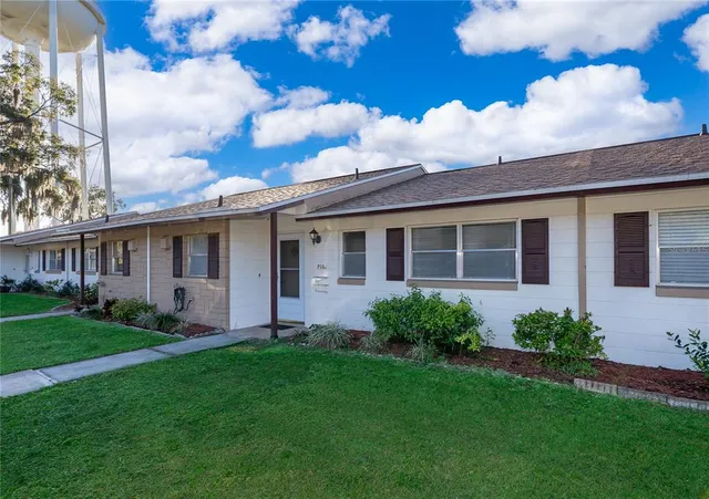 a view of a house with a garden