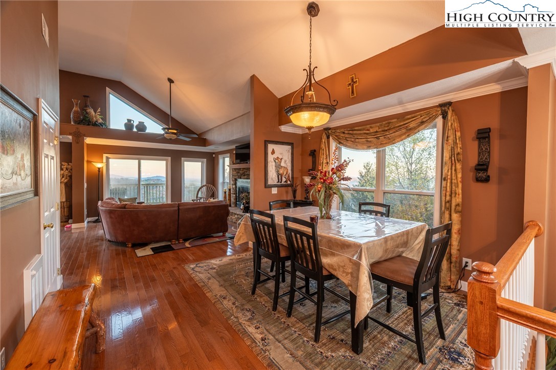 309 Pinnacle Ridge Road Beech Mountain, NC 28604 - Photo 10 of 45 a view of a dining room with furniture window and wooden floor