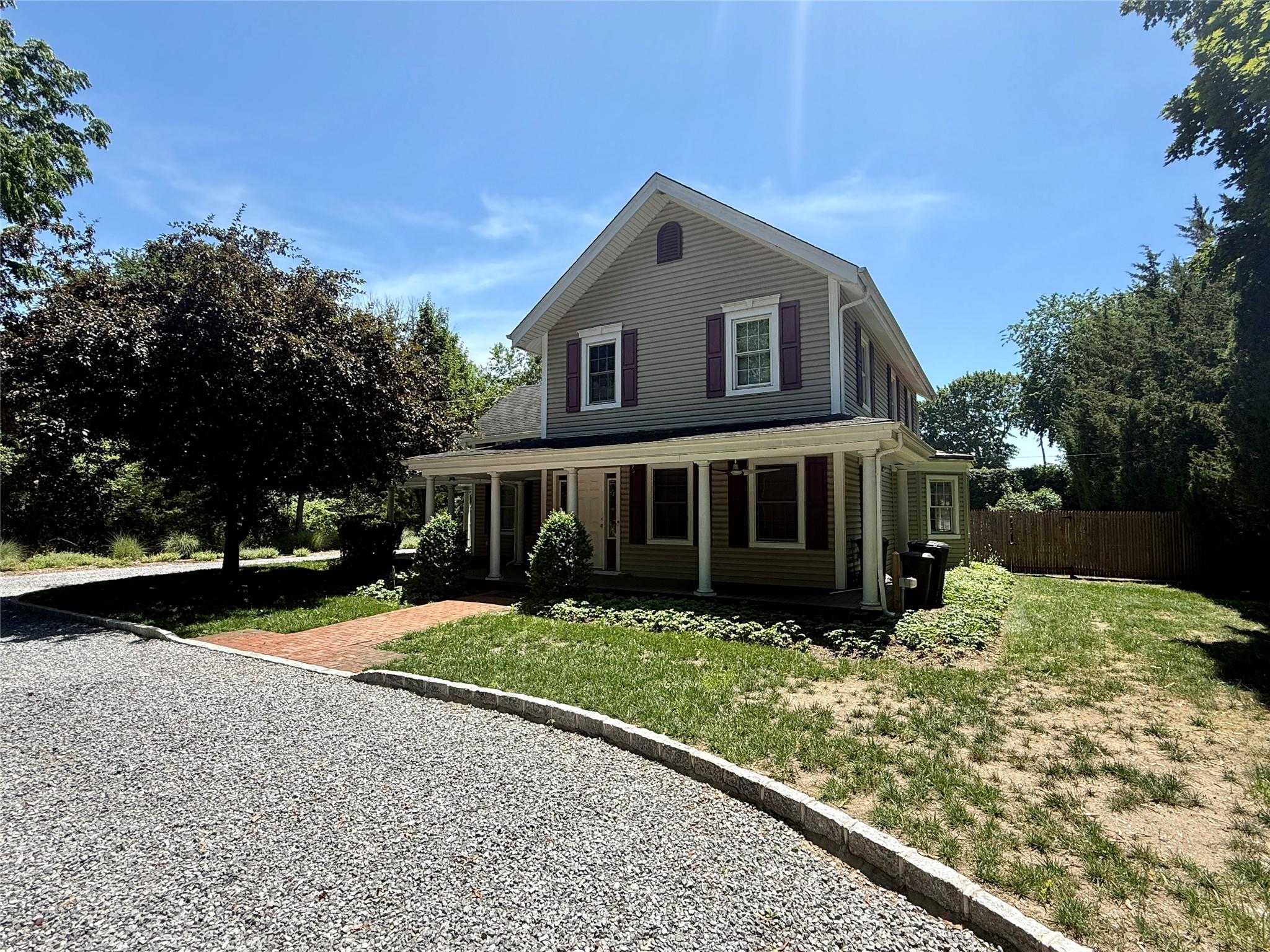 496 North Country Road St. James, NY 11780 - Photo 2 of 17 a front view of a house with a yard