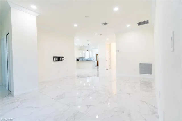 an empty room with white walls