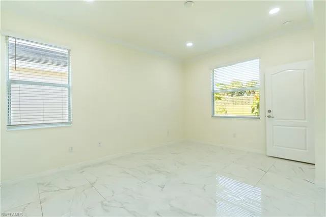 a view of an empty room and a window