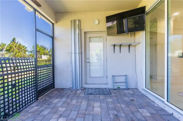 a view of front door of house and glass door