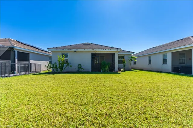 a front view of house with an outdoor space and seating area