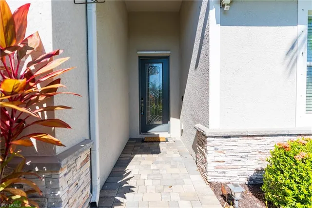 a view of a patio with a table and chairs