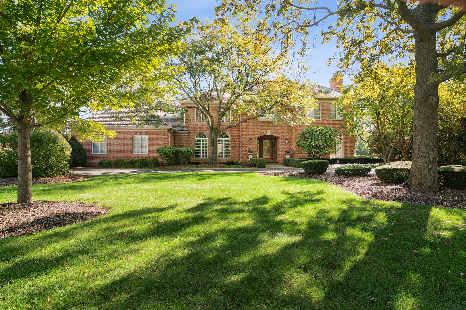 a view of house with backyard