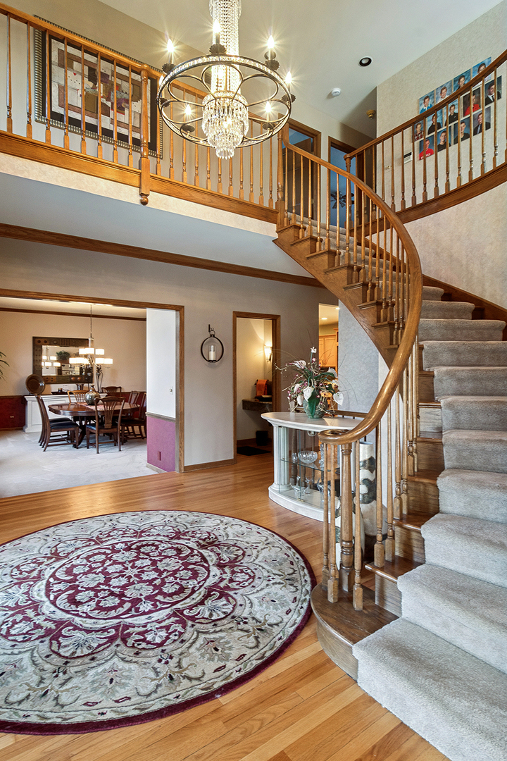1515 Galloway Drive Inverness, IL 60010 - Photo 11 of 60 a view of entryway dining room and hall with wooden floor