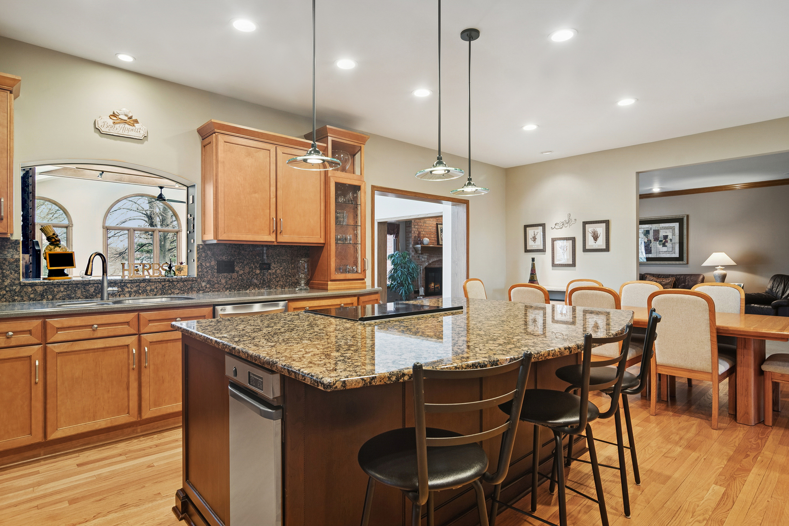 1515 Galloway Drive Inverness, IL 60010 - Photo 13 of 60 a kitchen with granite countertop a table chairs stove a sink and dishwasher