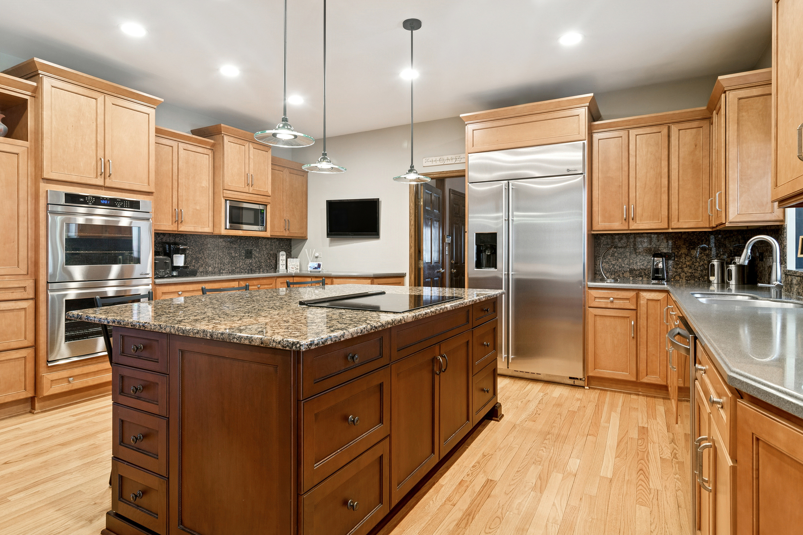 1515 Galloway Drive Inverness, IL 60010 - Photo 14 of 60 a kitchen with stainless steel appliances granite countertop a stove top oven a sink dishwasher a refrigerator and cabinets with wooden floor