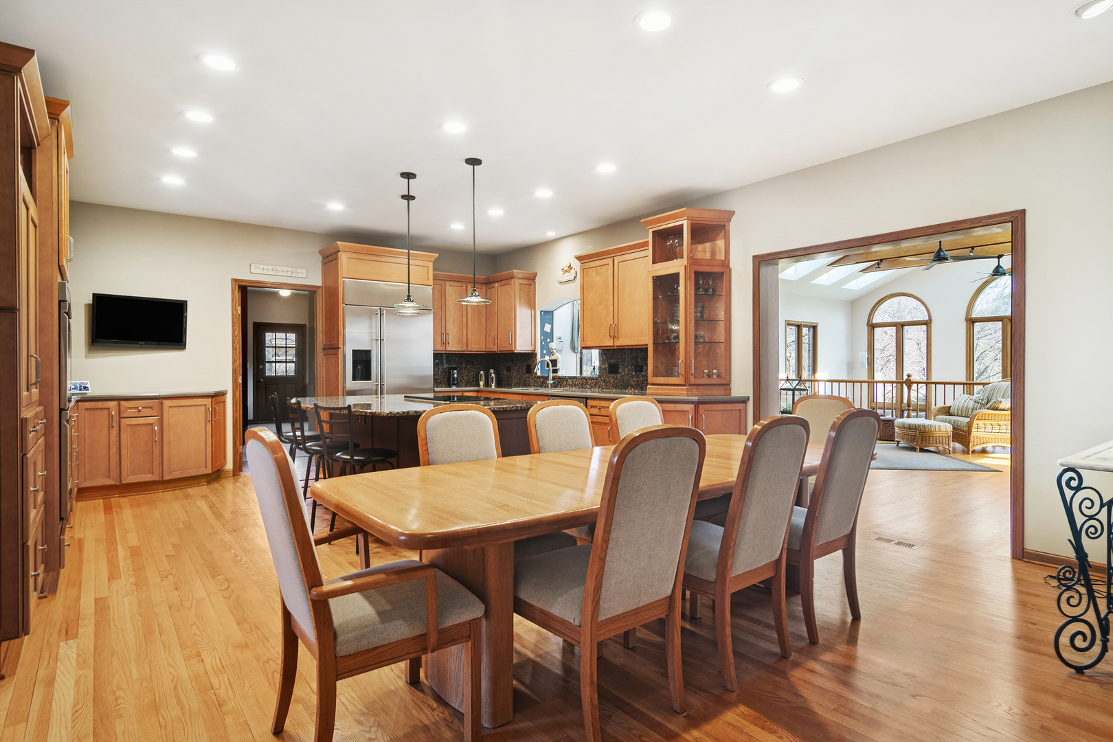 1515 Galloway Drive Inverness, IL 60010 - Photo 15 of 60 a dining room with stainless steel appliances kitchen island granite countertop a dining table chairs and a refrigerator