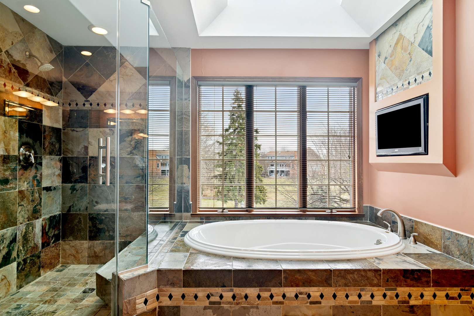 1515 Galloway Drive Inverness, IL 60010 - Photo 26 of 60 a spacious bathroom with a tub and a large window