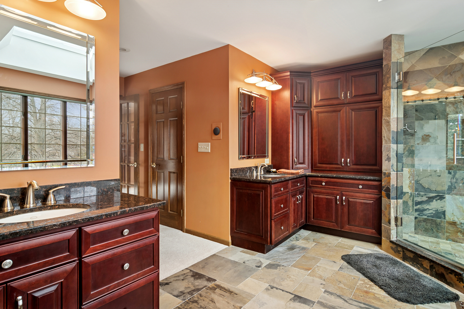 1515 Galloway Drive Inverness, IL 60010 - Photo 27 of 60 a bathroom with a granite countertop double vanity sink a mirror and a shower