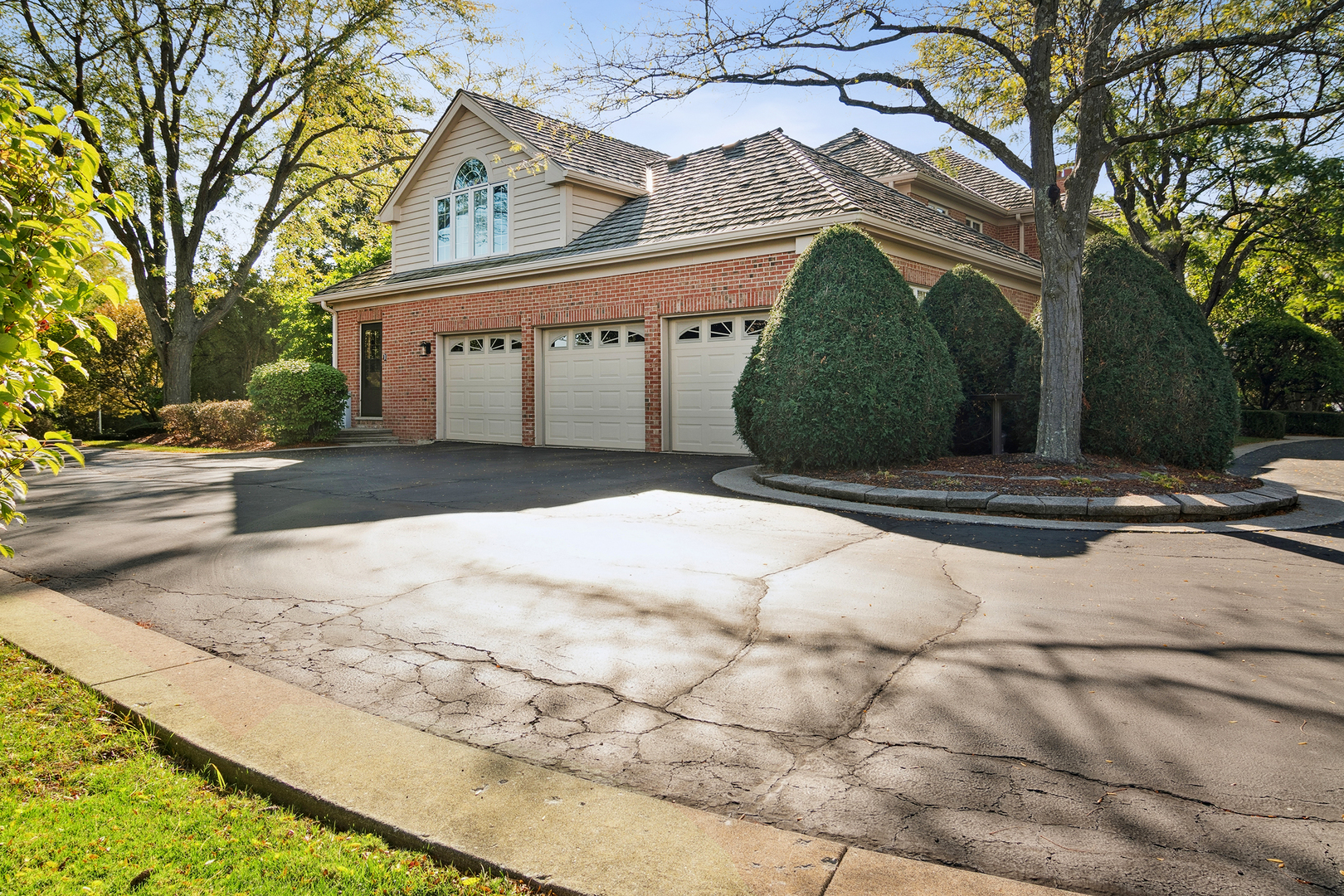 1515 Galloway Drive Inverness, IL 60010 - Photo 8 of 60 a front view of a house with a yard and garage