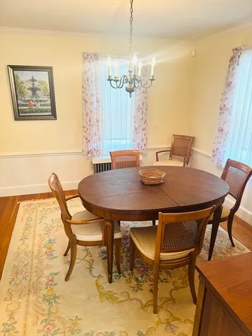 a view of a dining room with furniture and window