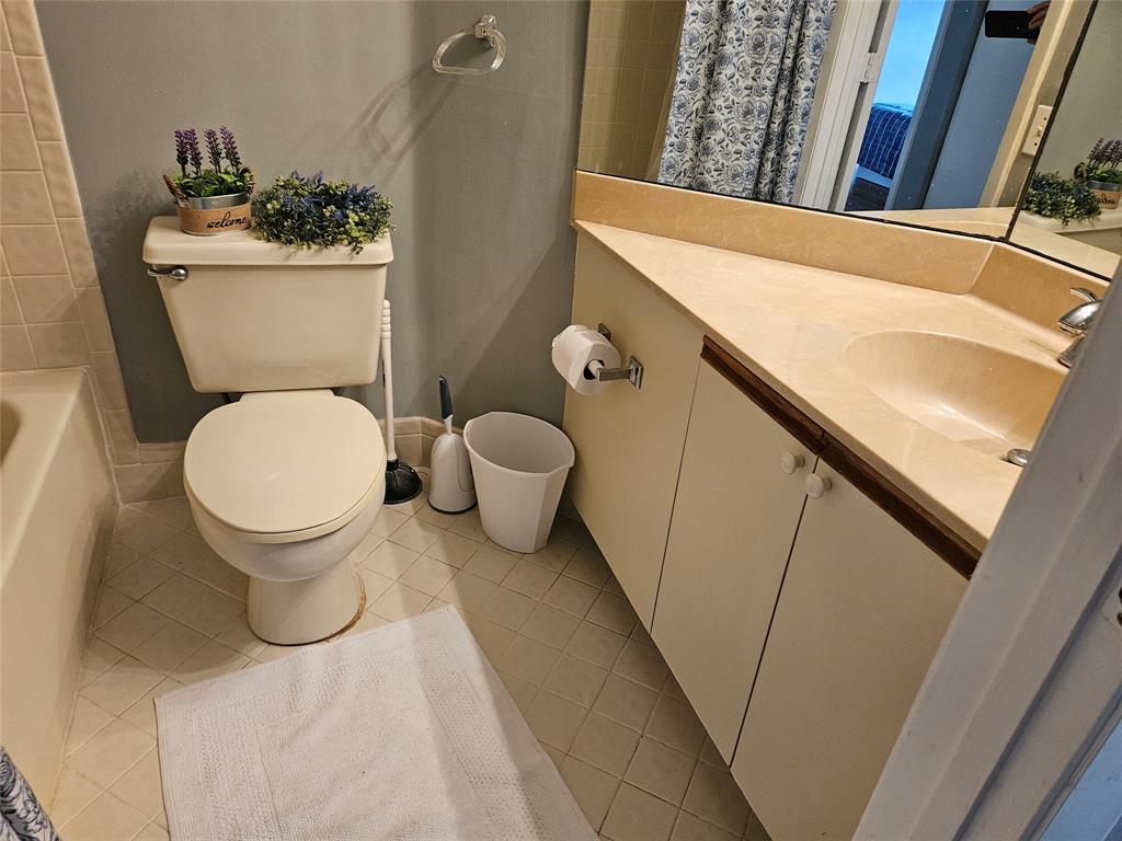 5203 Europa Drive, Unit G Boynton Beach, FL 33437 - Photo 16 of 29 a bathroom with a sink and a toilet
