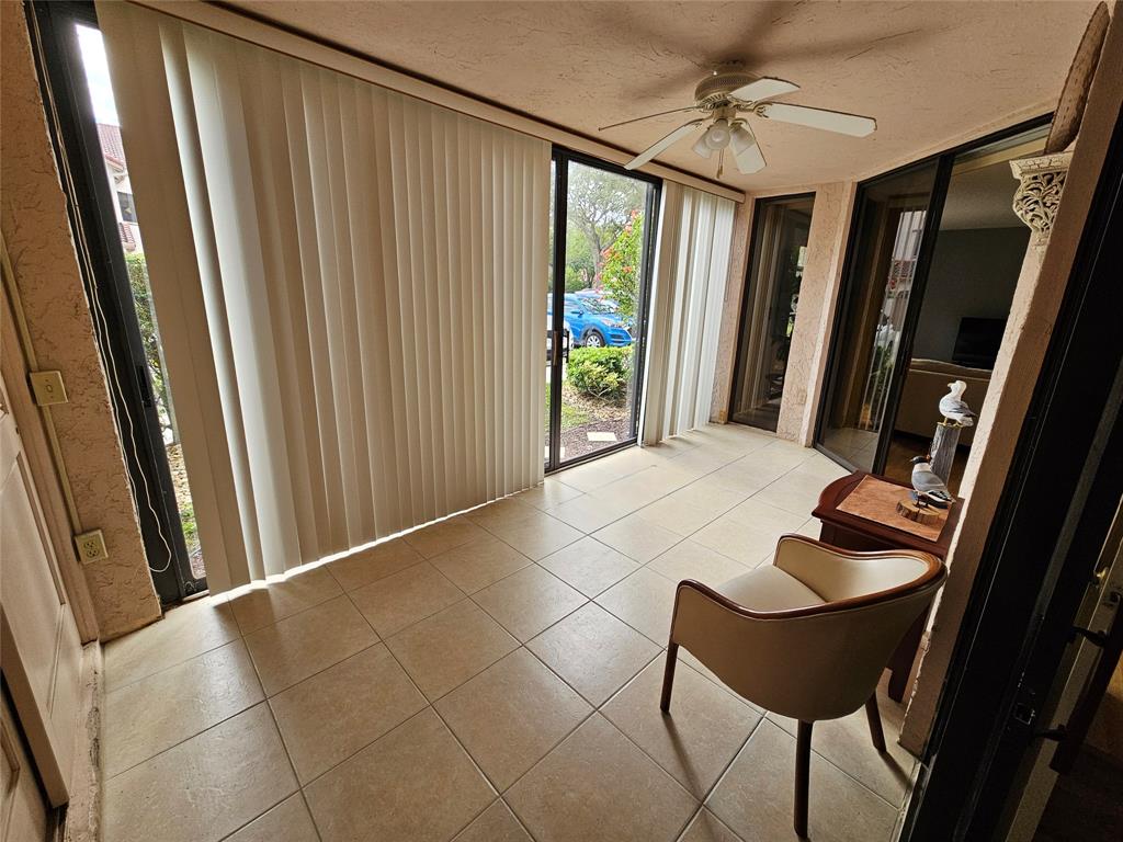 5203 Europa Drive, Unit G Boynton Beach, FL 33437 - Photo 17 of 29 a view of a hallway with seating area