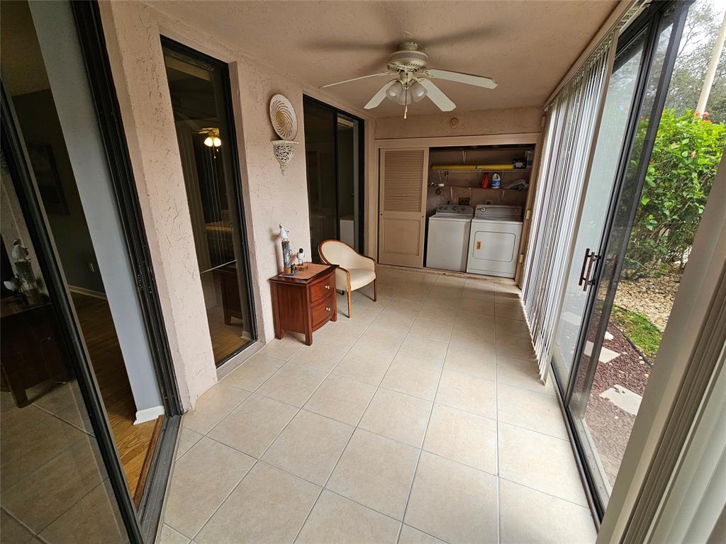 5203 Europa Drive, Unit G Boynton Beach, FL 33437 - Photo 18 of 29 a view of livingroom with furniture and large window