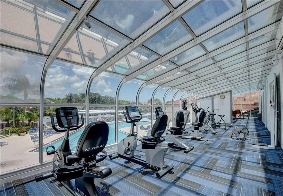 5203 Europa Drive, Unit G Boynton Beach, FL 33437 - Photo 25 of 29 a view of a room with gym equipment