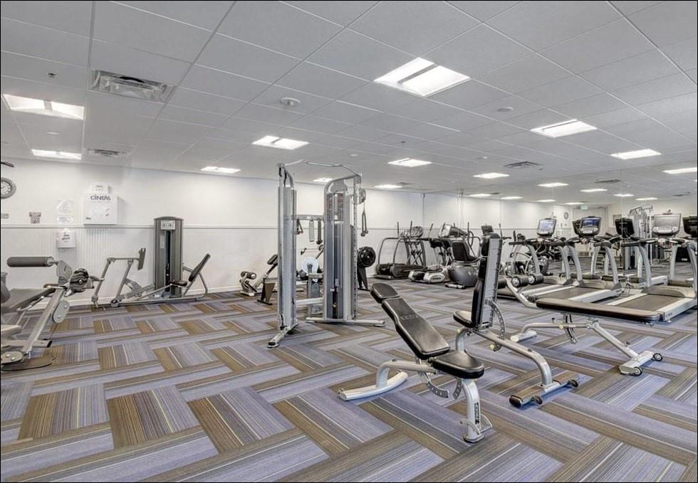 5203 Europa Drive, Unit G Boynton Beach, FL 33437 - Photo 26 of 29 a view of a room with gym equipment