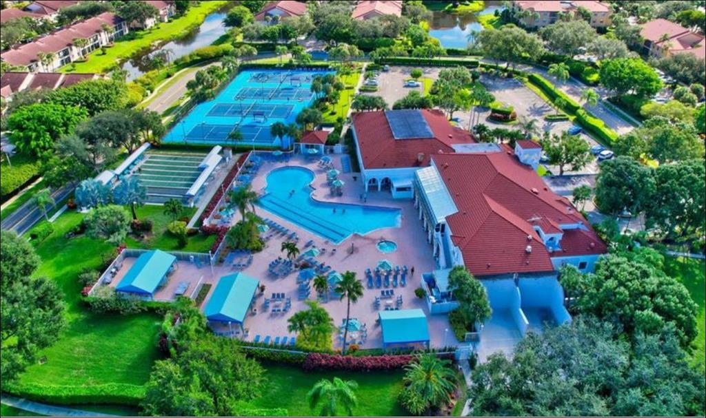 5203 Europa Drive, Unit G Boynton Beach, FL 33437 - Photo 29 of 29 an aerial view of house with swimming pool outdoor seating and yard