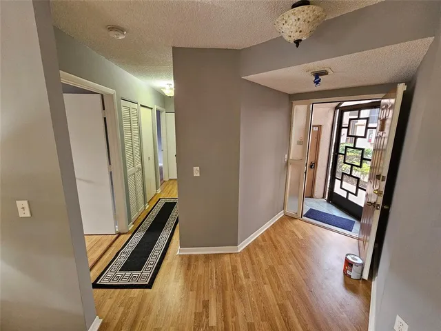 a dining room with furniture and a lamp