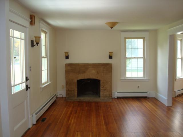 270 Huntington Road Chester, MA 01011 - Photo 6 of 9 a view of an empty room with wooden floor and a window