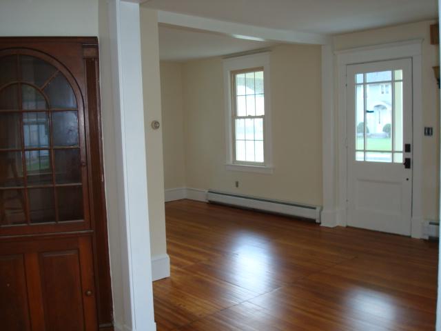 270 Huntington Road Chester, MA 01011 - Photo 7 of 9 an empty room with wooden floor and windows