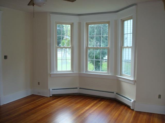 270 Huntington Road Chester, MA 01011 - Photo 9 of 9 an empty room with wooden floor and windows