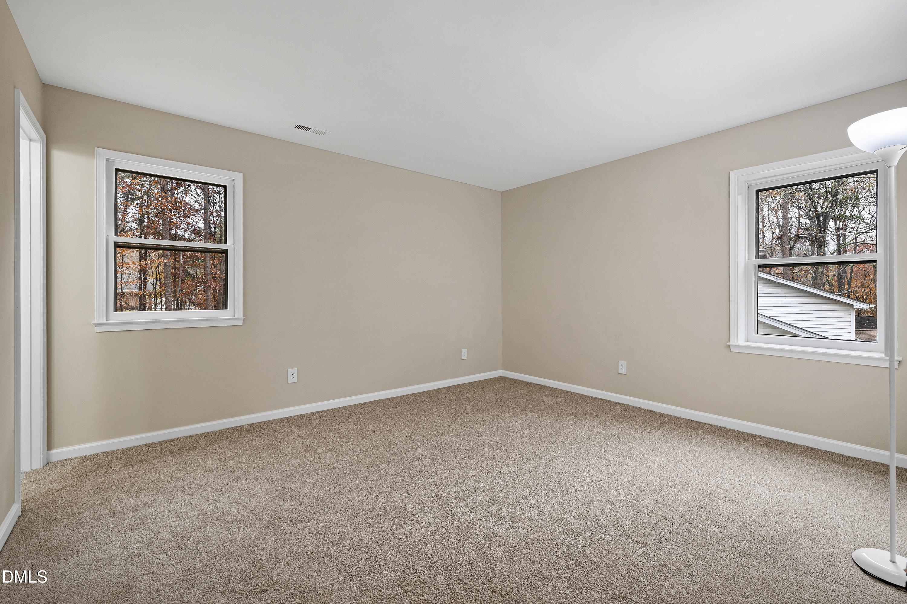 7812 Hemlock Court Raleigh, NC 27615 - Photo 12 of 25 a view of an empty room with a window