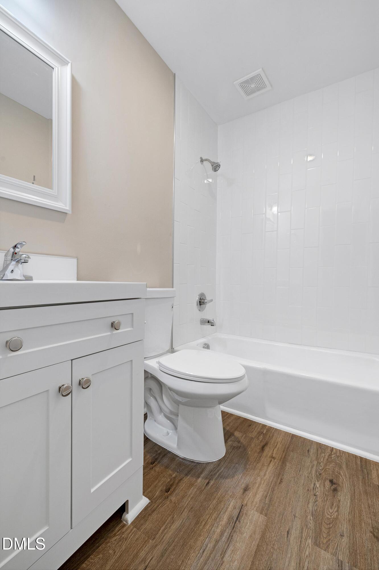 7812 Hemlock Court Raleigh, NC 27615 - Photo 13 of 25 a bathroom with a sink a toilet and shower