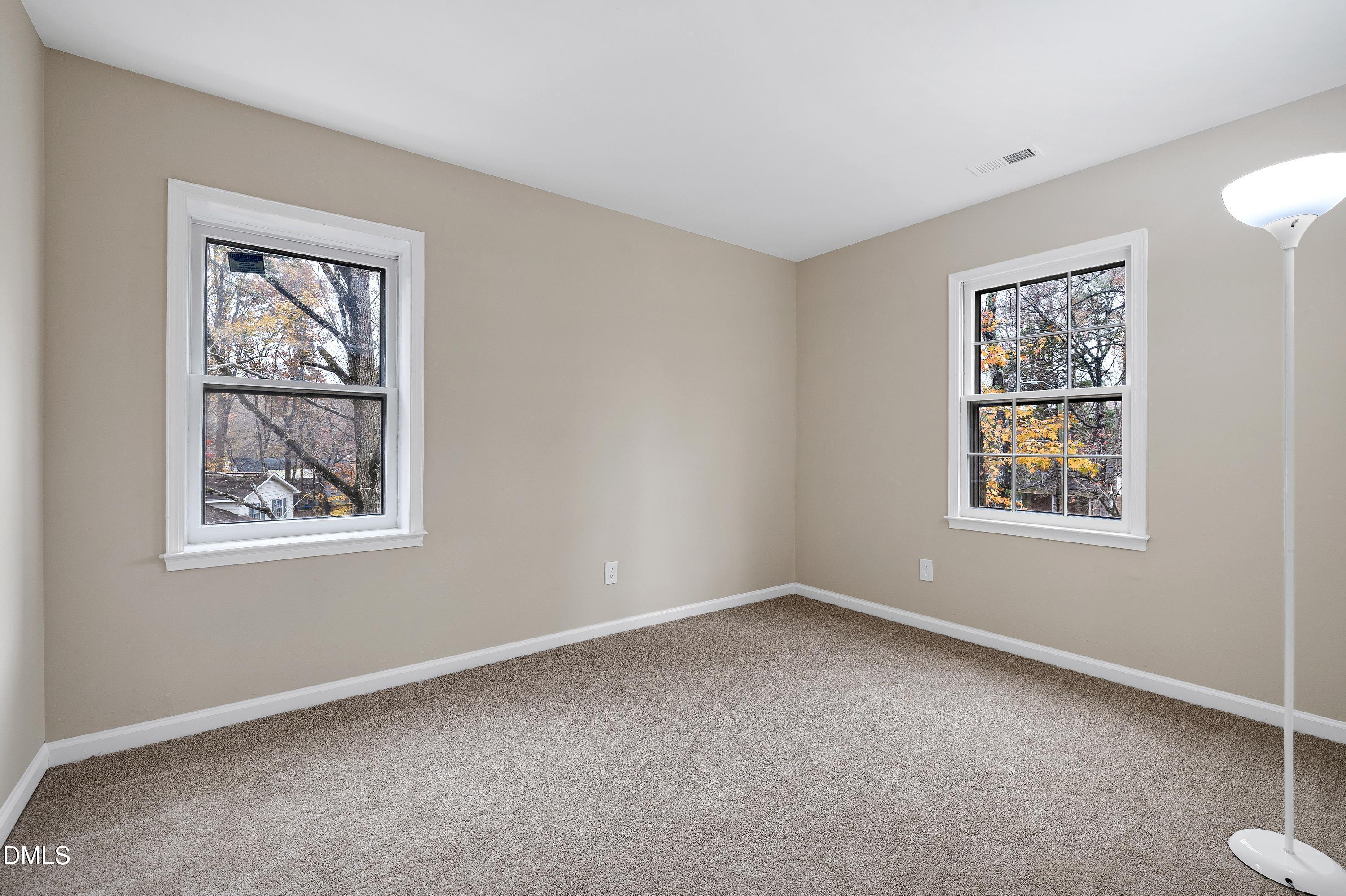 7812 Hemlock Court Raleigh, NC 27615 - Photo 16 of 25 a view of an empty room with a window