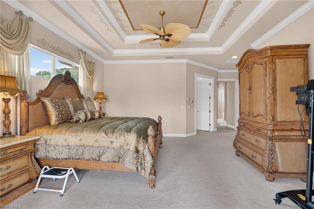 1964 Rialto Way Alva, FL 33920 - Photo 20 of 50 a bedroom with a bed and a chandelier