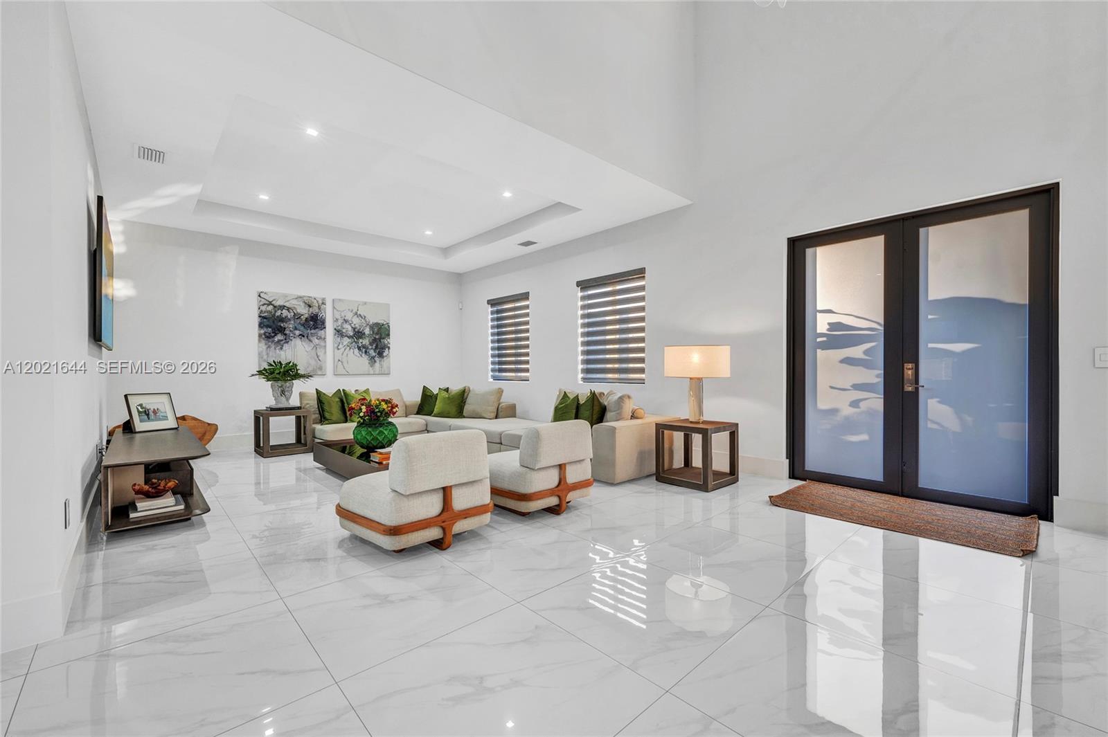 7800 Southwest 9th Terrace Miami, FL 33144 - Photo 27 of 64 a living room with furniture and large windows