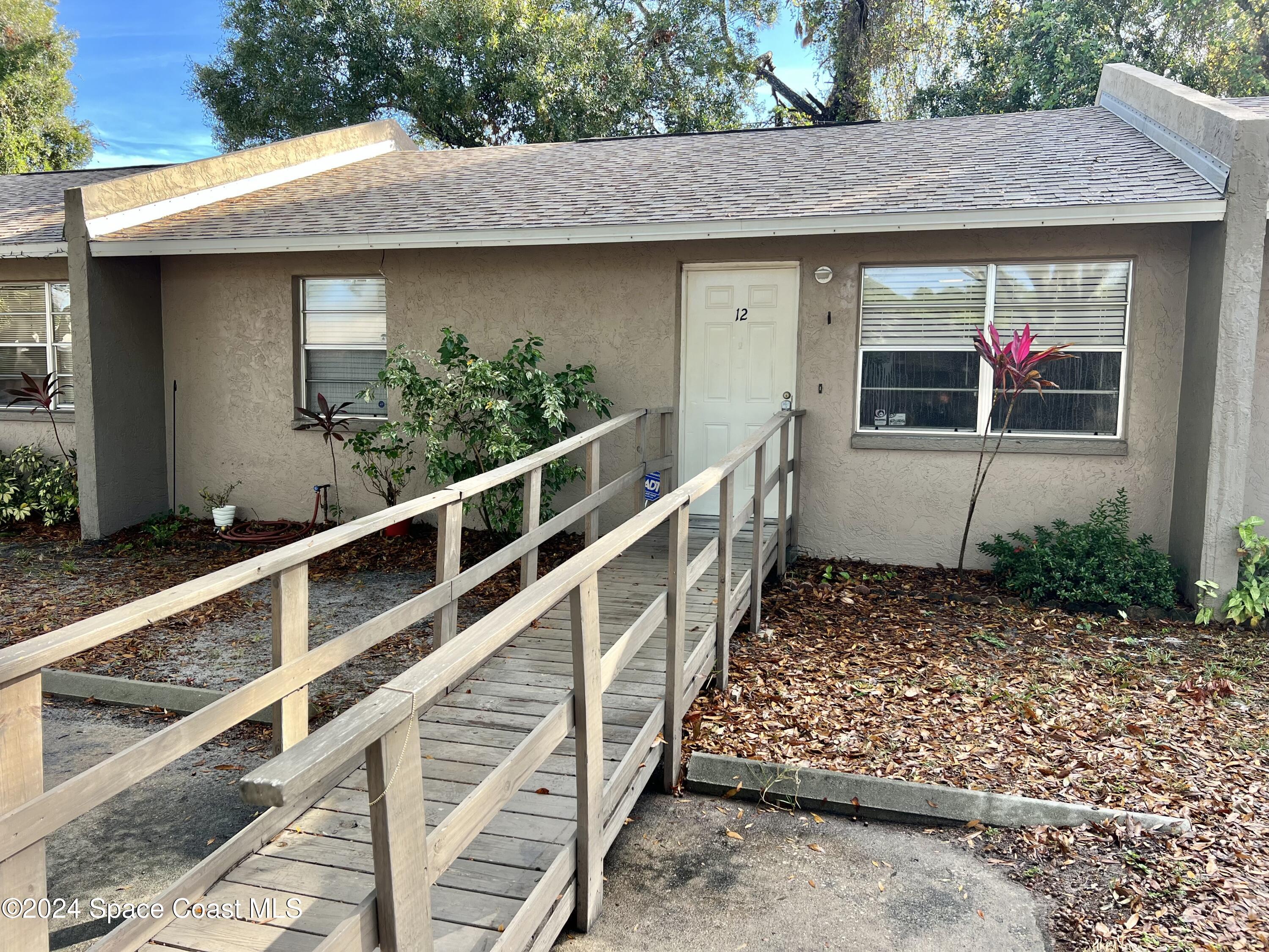 3225 Murrell Road, Unit 12 Rockledge, FL 32955 - Photo 2 of 14 a view of a house with a window