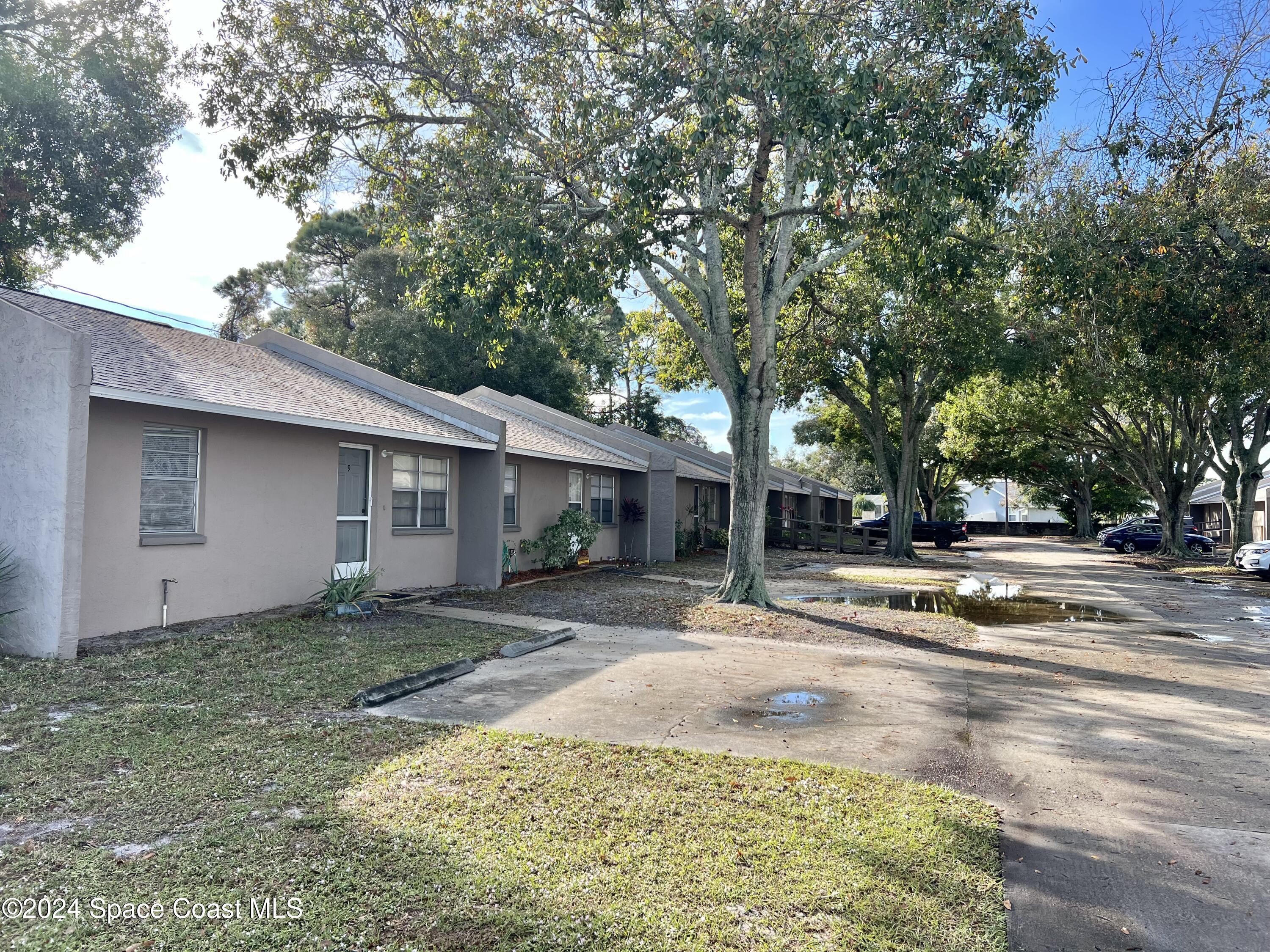 3225 Murrell Road, Unit 12 Rockledge, FL 32955 - Photo 3 of 14 a view of a house with a outdoor space