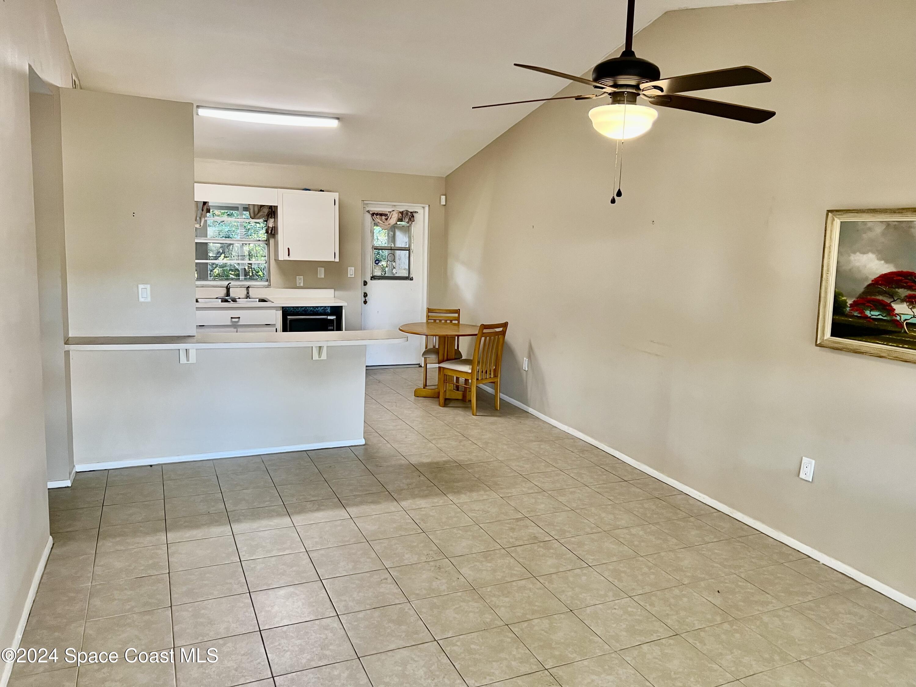 3225 Murrell Road, Unit 12 Rockledge, FL 32955 - Photo 4 of 14 a view of a kitchen with a sink cabinets and appliances