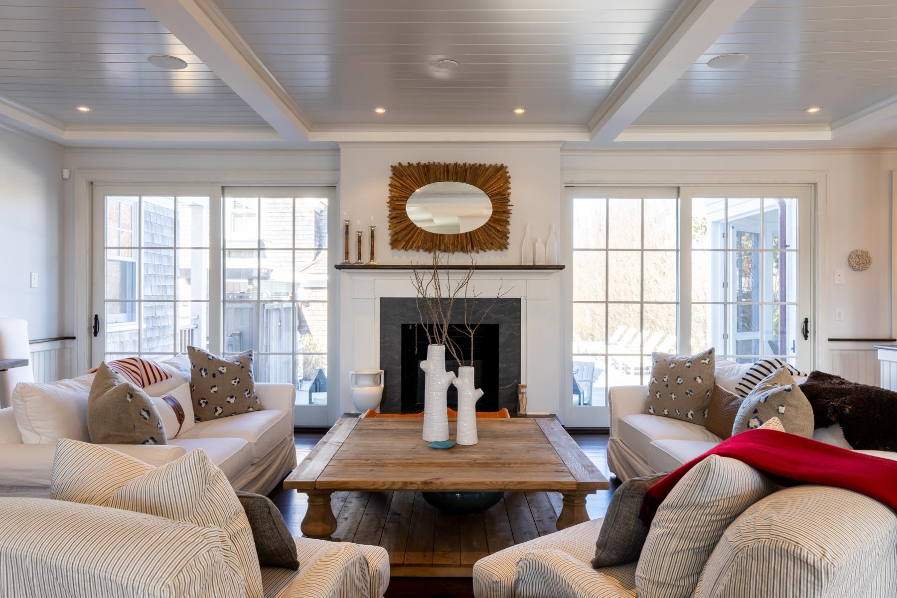 25 Pierce Lane Edgartown, MA 02539 - Photo 11 of 52 a living room with furniture and a fireplace
