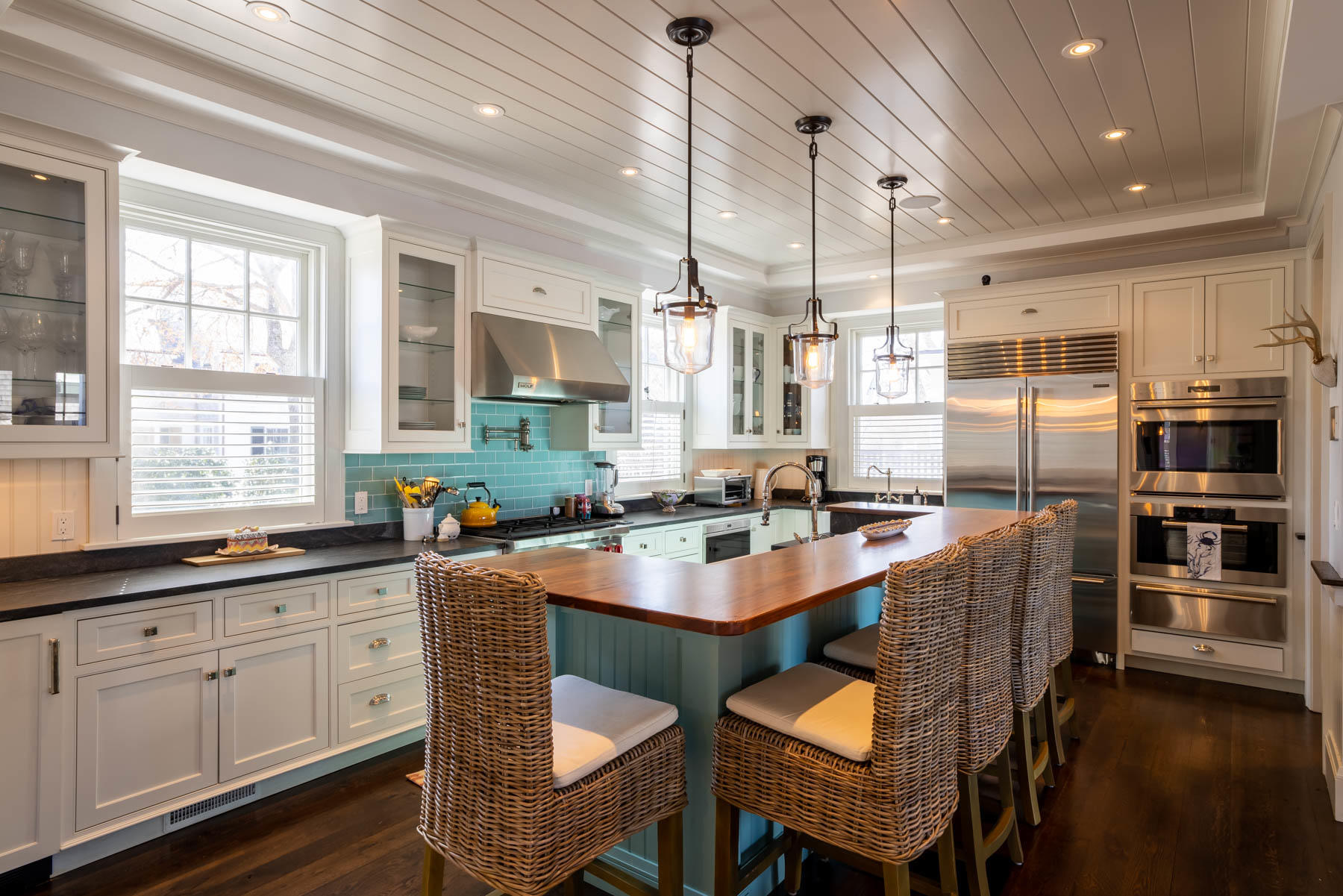 25 Pierce Lane Edgartown, MA 02539 - Photo 17 of 52 a kitchen with stainless steel appliances granite countertop a sink a stove a refrigerator cabinets and chairs