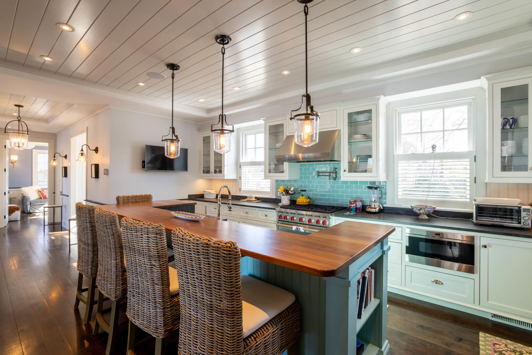 25 Pierce Lane Edgartown, MA 02539 - Photo 20 of 52 a kitchen with stainless steel appliances granite countertop a stove a sink a microwave oven a stove and white cabinets with wooden floor