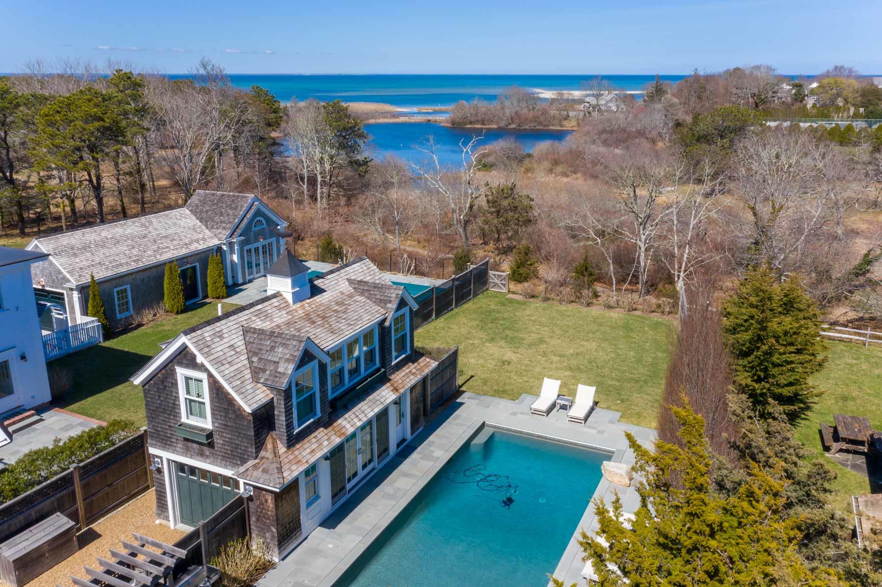 25 Pierce Lane Edgartown, MA 02539 - Photo 3 of 52 a view of a house with a yard from a balcony